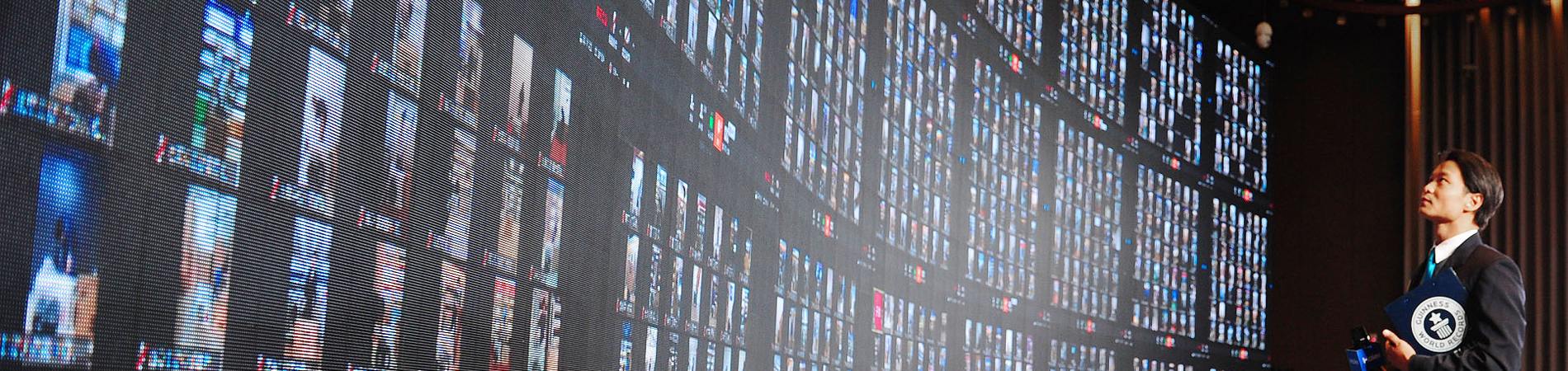 adjudicator looking at huge screen