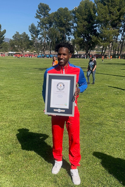 CF founder holding GWR certificate