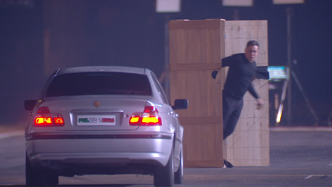 box-escape-header-klauss-exiting-box-as-car-approachestive text here